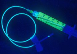 A teaspoon of Fluorescein dye IV injection is injected in the arm